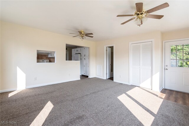 interior space with ceiling fan and carpet