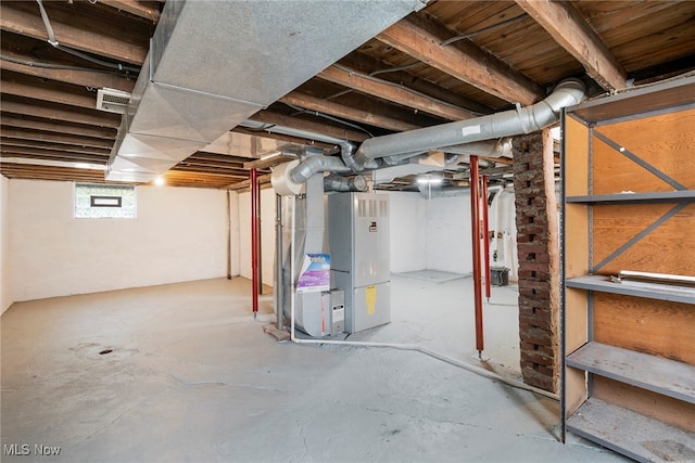 basement featuring heating unit