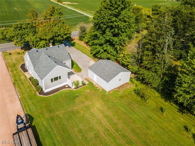 birds eye view of property with a rural view