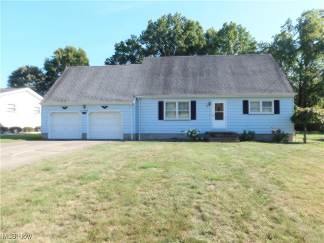 view of front facade featuring a garage and a front lawn