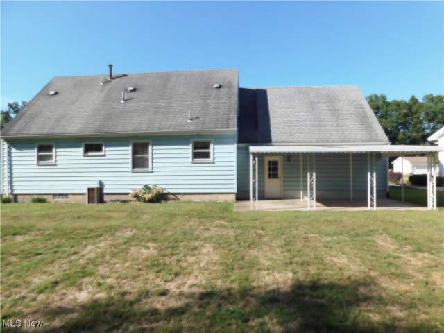 back of house featuring a yard and a patio