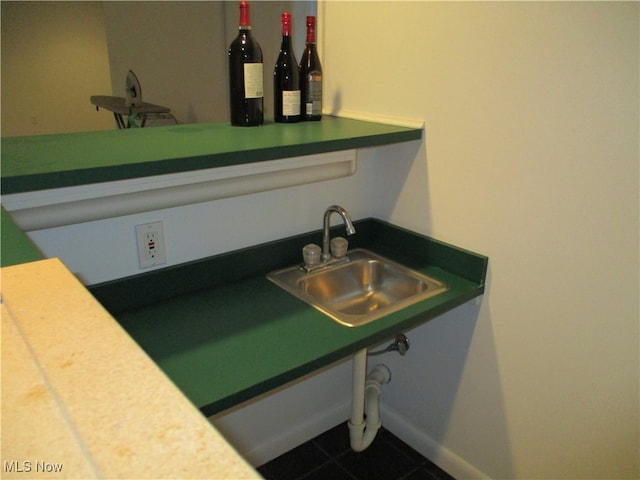 details with sink and tile patterned floors