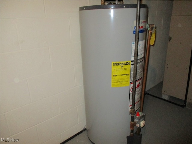 utility room featuring water heater