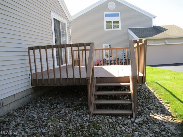 wooden deck featuring a garage