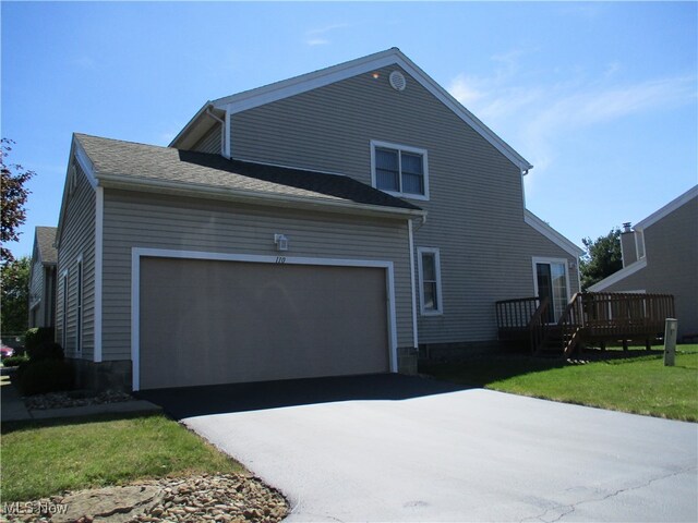 exterior space with a garage and a front yard