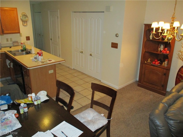 dining room featuring sink, light tile patterned floors, and a notable chandelier