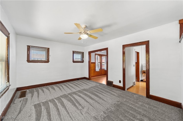 unfurnished room featuring light hardwood / wood-style flooring, ceiling fan, and a healthy amount of sunlight