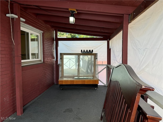 unfurnished sunroom with lofted ceiling