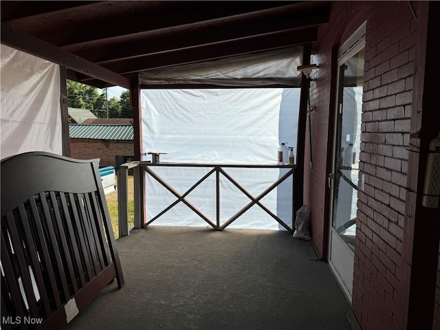 view of patio featuring a balcony