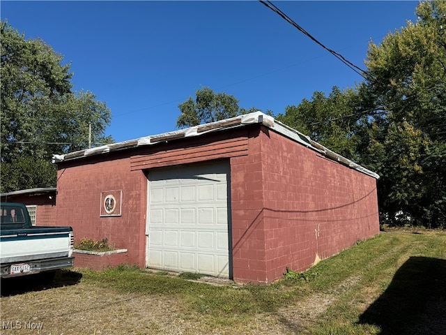 garage with a yard