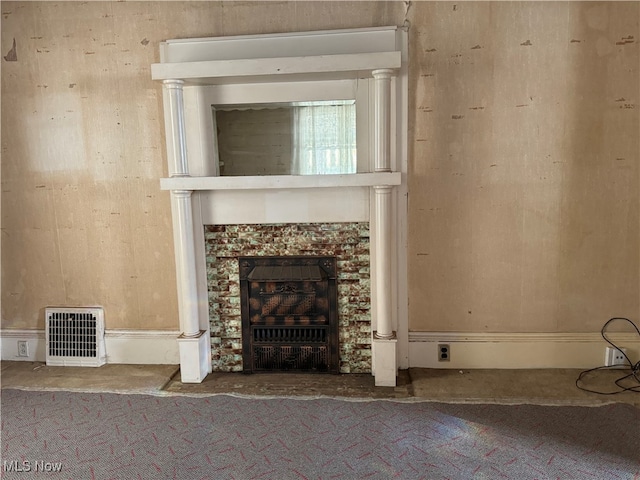 interior space featuring a fireplace and carpet