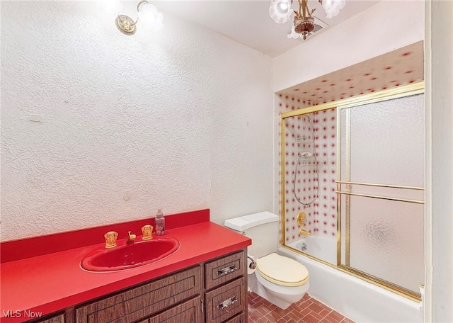 full bathroom with vanity, toilet, and enclosed tub / shower combo