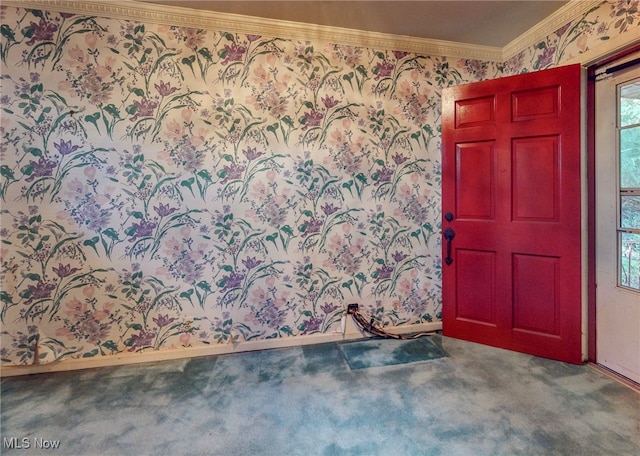 carpeted foyer with crown molding