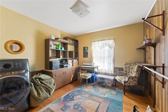 office space featuring washer / dryer and hardwood / wood-style floors