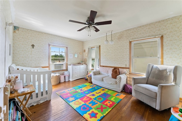 playroom featuring wood-type flooring, cooling unit, and ceiling fan