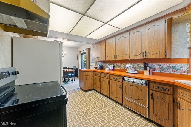 kitchen with dishwasher, stainless steel electric range, and a paneled ceiling