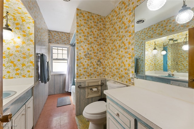 bathroom with tile patterned floors, toilet, and vanity