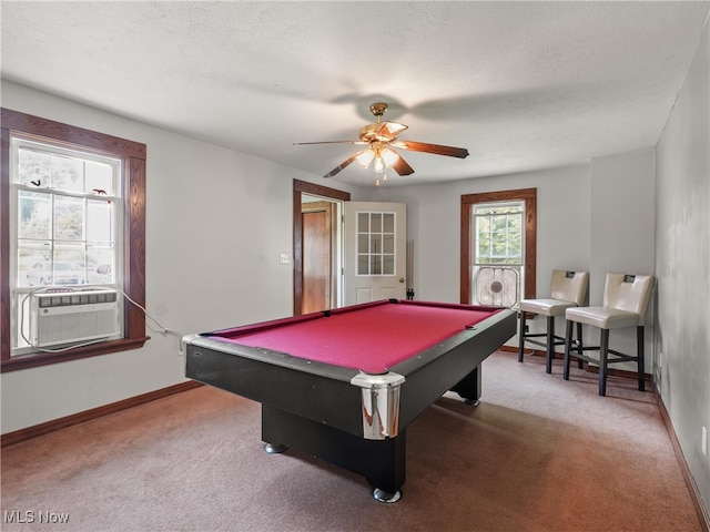 game room with a textured ceiling, ceiling fan, pool table, and carpet flooring