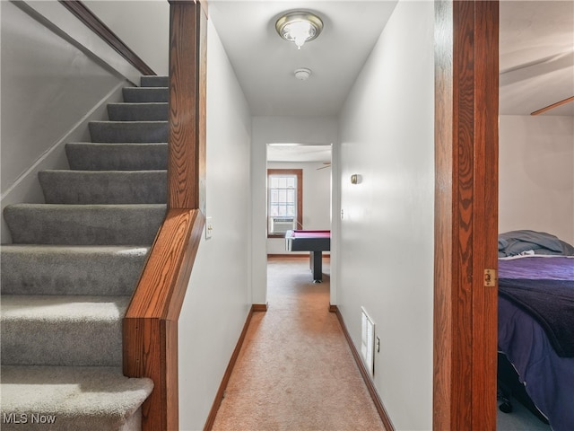 interior space featuring cooling unit and light colored carpet