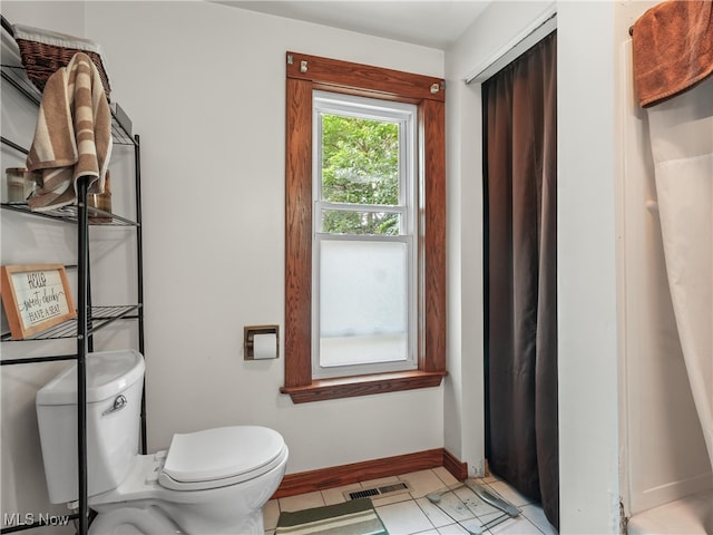 bathroom featuring toilet