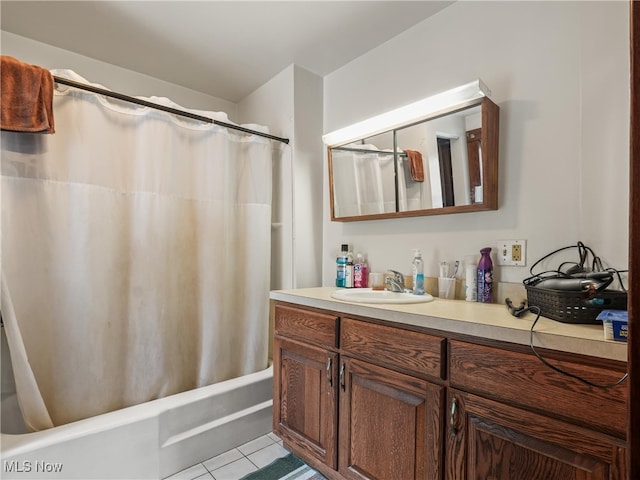 bathroom featuring tile patterned flooring, shower / tub combo with curtain, and vanity