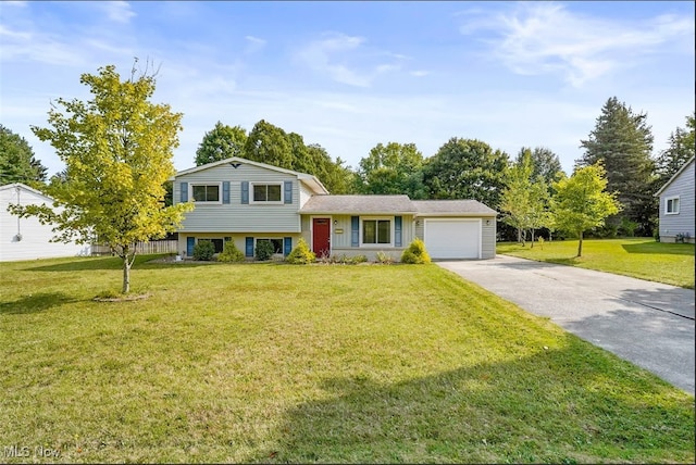 split level home featuring a garage and a front lawn