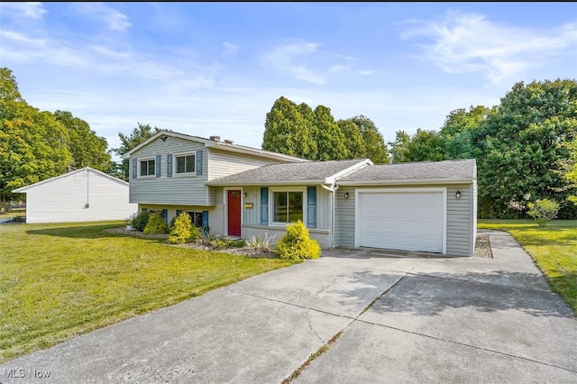 split level home featuring a garage and a front lawn