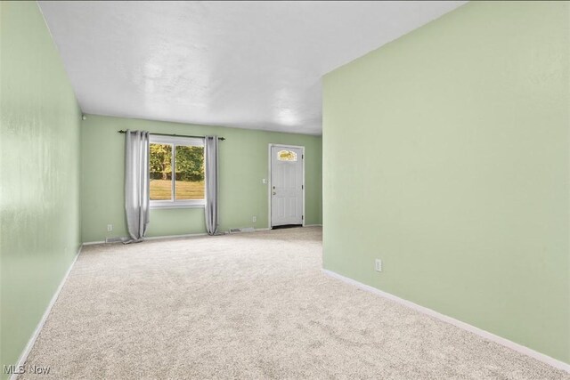 spare room featuring carpet