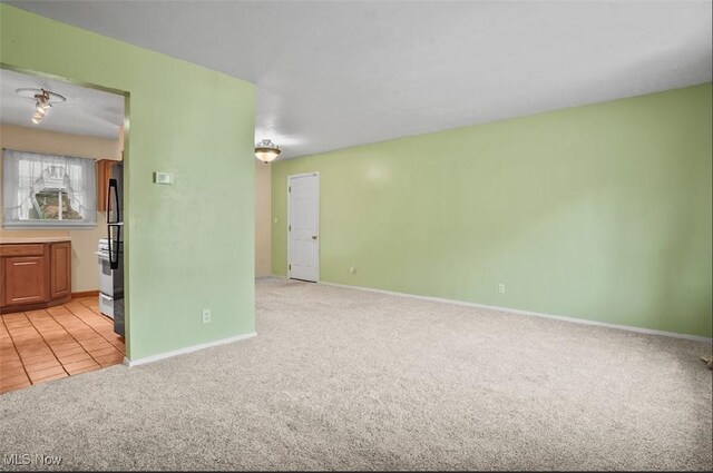 empty room featuring light carpet