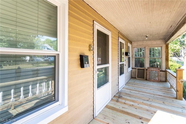 wooden deck featuring covered porch