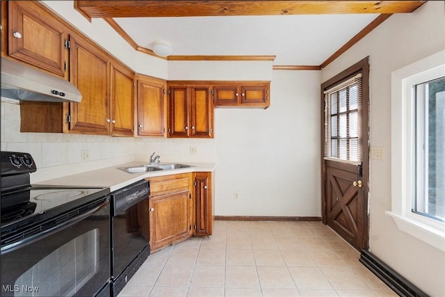 kitchen with brown cabinets, black appliances, and a sink