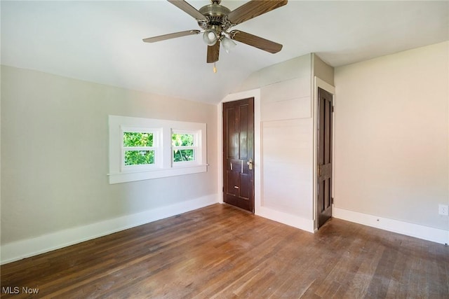 unfurnished bedroom featuring a ceiling fan, a closet, baseboards, and wood finished floors