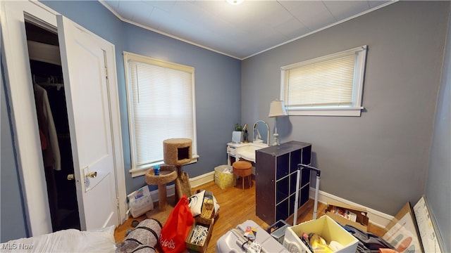 interior space with crown molding and hardwood / wood-style floors