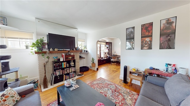 living room with a fireplace and light hardwood / wood-style floors