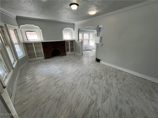 unfurnished living room with a fireplace, a textured ceiling, and ornamental molding