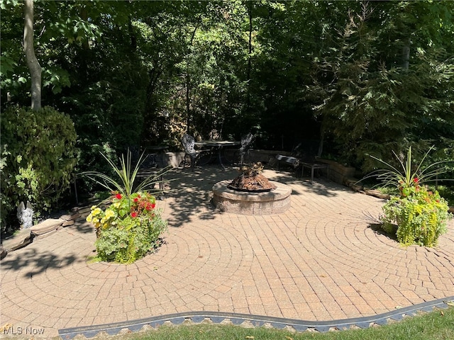 view of patio featuring an outdoor fire pit