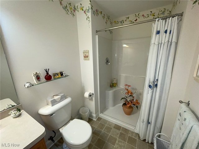 bathroom with curtained shower, tile patterned flooring, toilet, and vanity