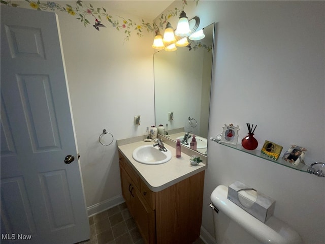 bathroom with tile patterned floors, toilet, and vanity