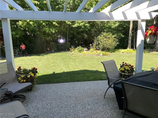 view of yard with a pergola and a patio