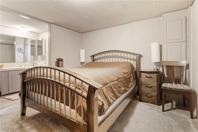 carpeted bedroom featuring a textured ceiling