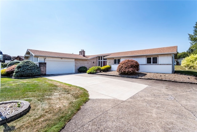 ranch-style home with a garage and a front yard