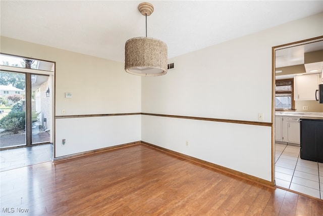 unfurnished room featuring light hardwood / wood-style flooring