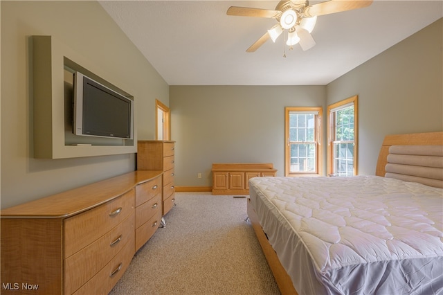 bedroom featuring ceiling fan and light carpet