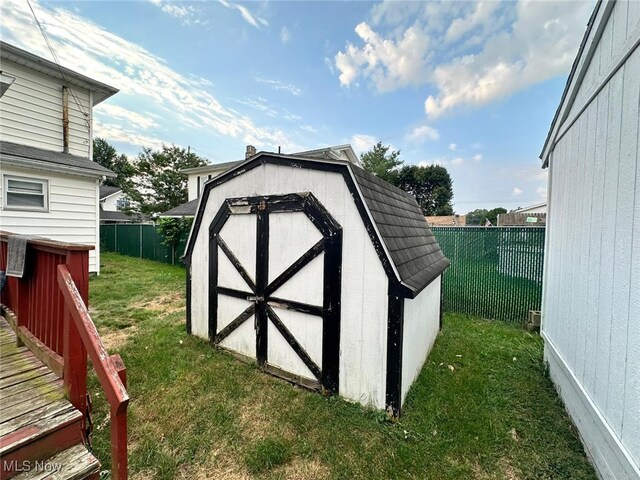 view of outbuilding featuring a lawn