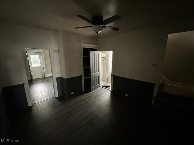 bedroom with ceiling fan and dark hardwood / wood-style flooring