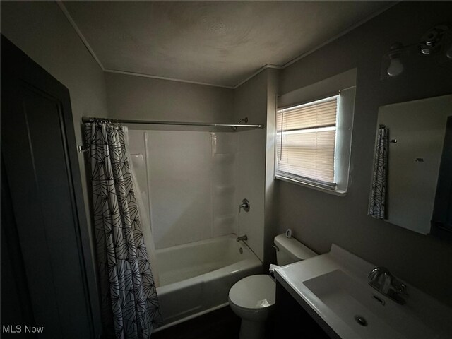 full bathroom with ornamental molding, vanity, toilet, and shower / bathtub combination with curtain