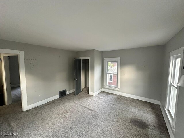 unfurnished bedroom featuring carpet