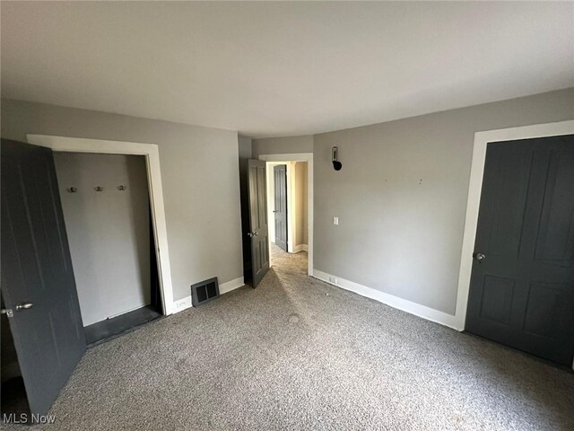 unfurnished bedroom with carpet floors