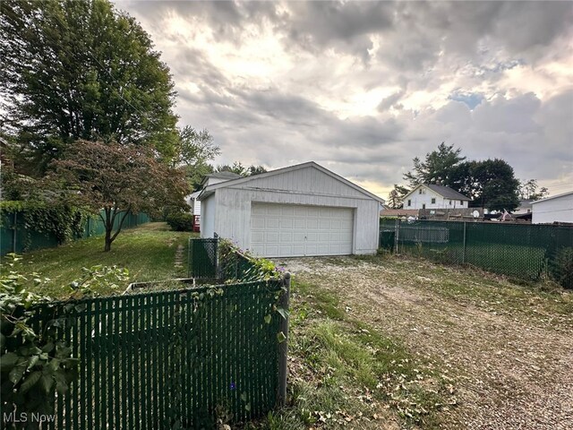 garage featuring a yard