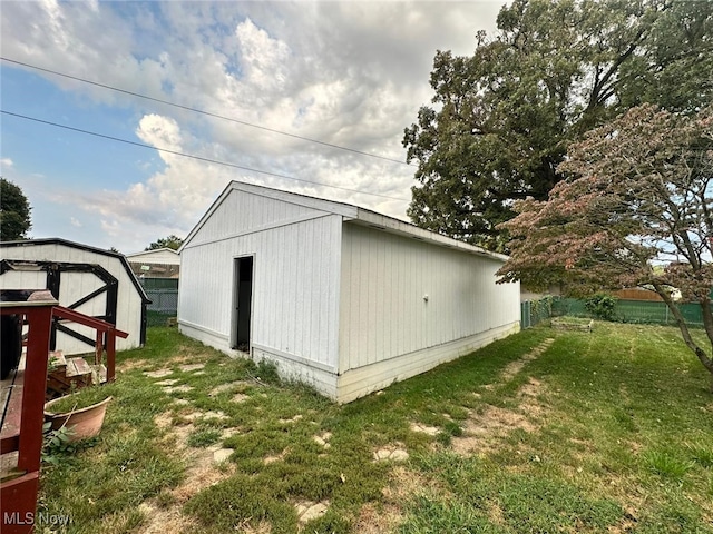 view of outdoor structure with a lawn